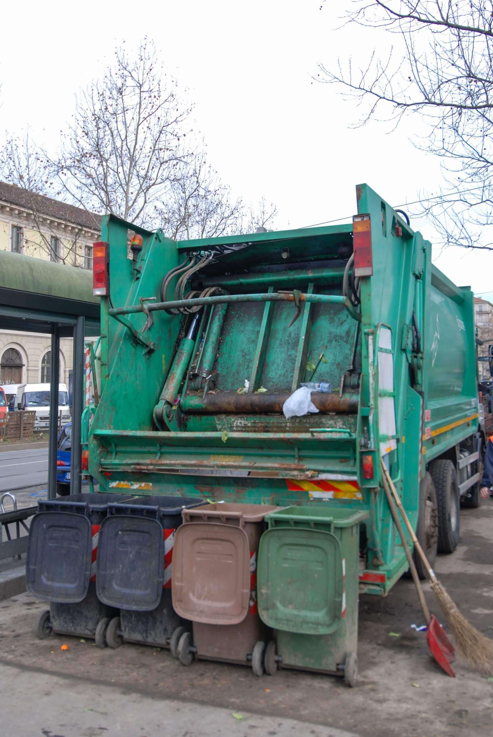 Trucks for collecting bins with waste with food waste at the mar